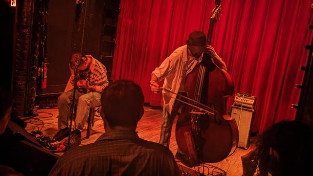 Ryley Walker plays electric guitar, Scott Colberg plays upright bass