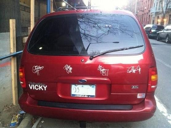 red minivan with KISS signatures 