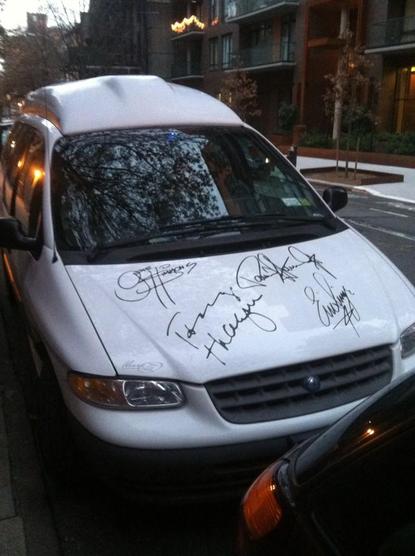 white minivan with KISS signatures 