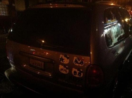minivan with hello kitty/KISS logos 
