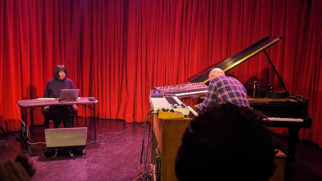 Ikue Mori behind laptop, John Medeski behind keyboards 