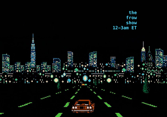 a car heads towards a city skyline