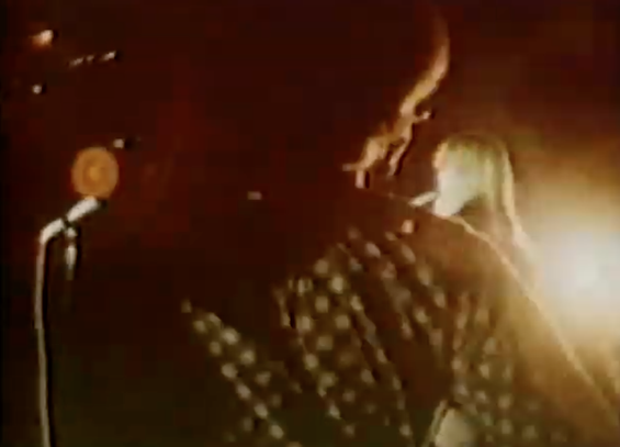 Sterling Morrison plays guitar, Nico visible over shoulder