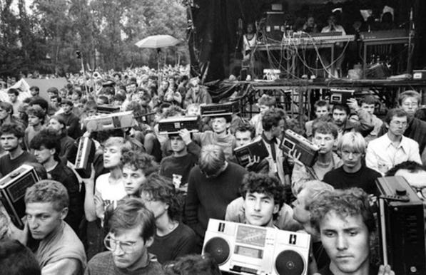 people hold boomboxes at Jarocin Festival