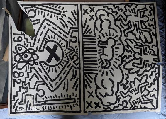 Keith Haring poster with gash in it