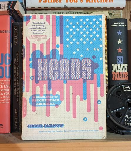 Book on shelf: Heads: A Biography of Psychedelic America