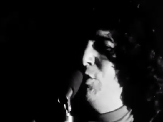 Jerry Garcia singing, in black and white