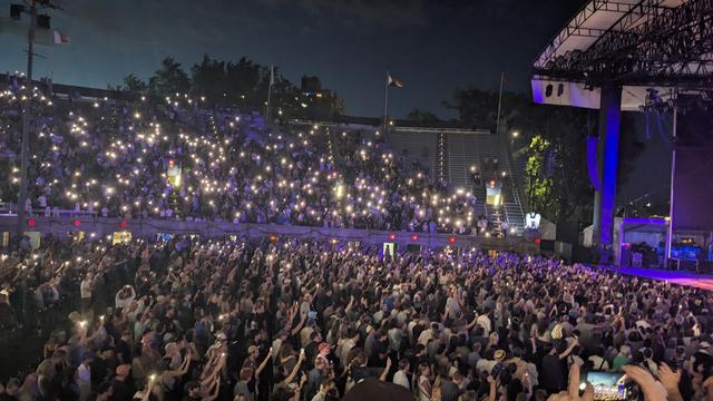 wilco fans hold up lit up phones during California Stars