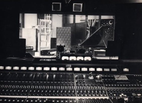 the view of a studio from the control room