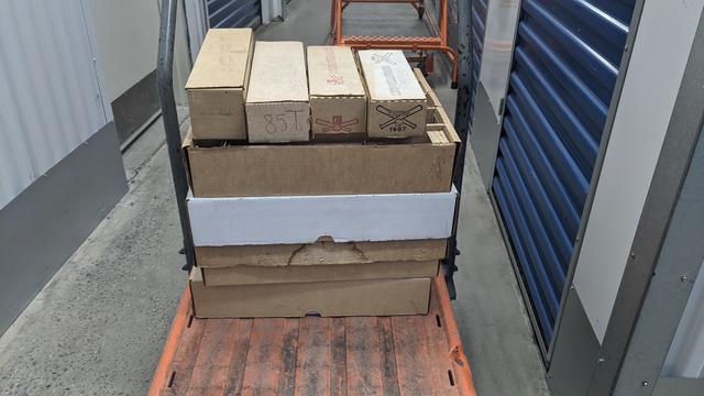 baseball cards stacked up on moving pallet