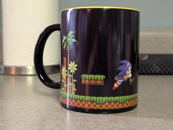 A Sonic the Hedgehog mug where most of it is black.