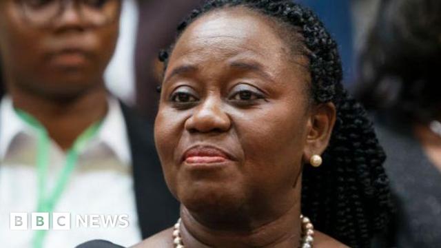 Gertrude Torkornoo is pictured wearing a black outfit and beaded necklace