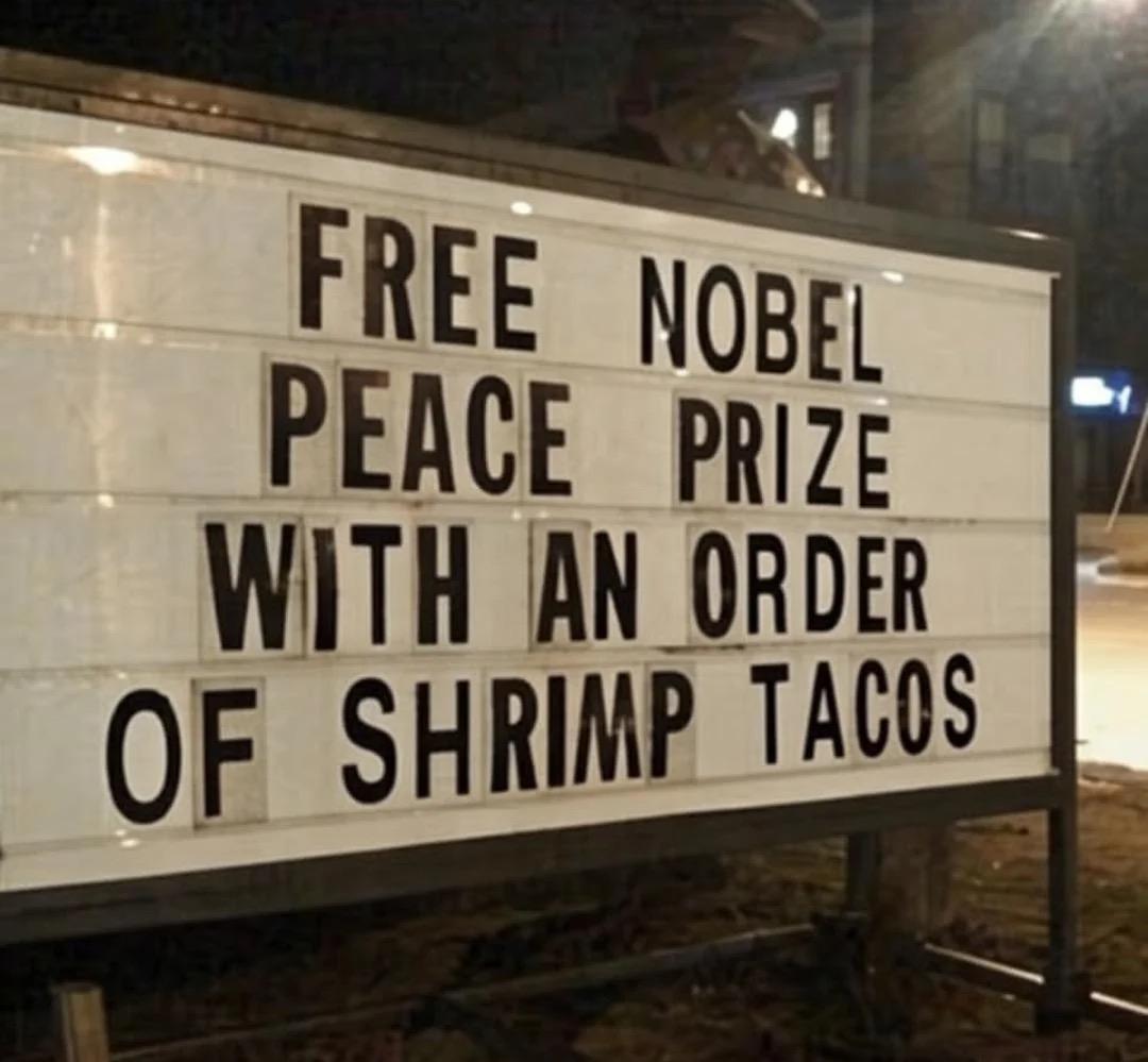 Sign that says, โFree Nobel Peace Prize with an order of shrimp tacos.โ