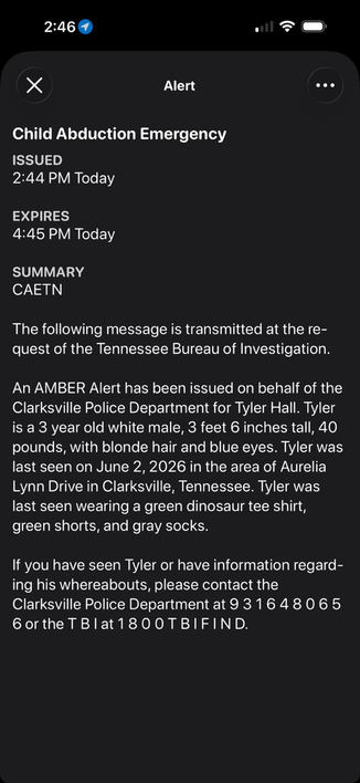 Full-screen 'Child Abduction Emergency' alert detail in a weather app, issued at 2:44 PM and expiring at 4:45 PM, summary 'CAETN.' The body relays a Tennessee Bureau of Investigation AMBER Alert from the Clarksville Police Department for a 3-year-old boy named Tyler Hall, with a physical description, clothing, last-seen location and date, and contact phone numbers.