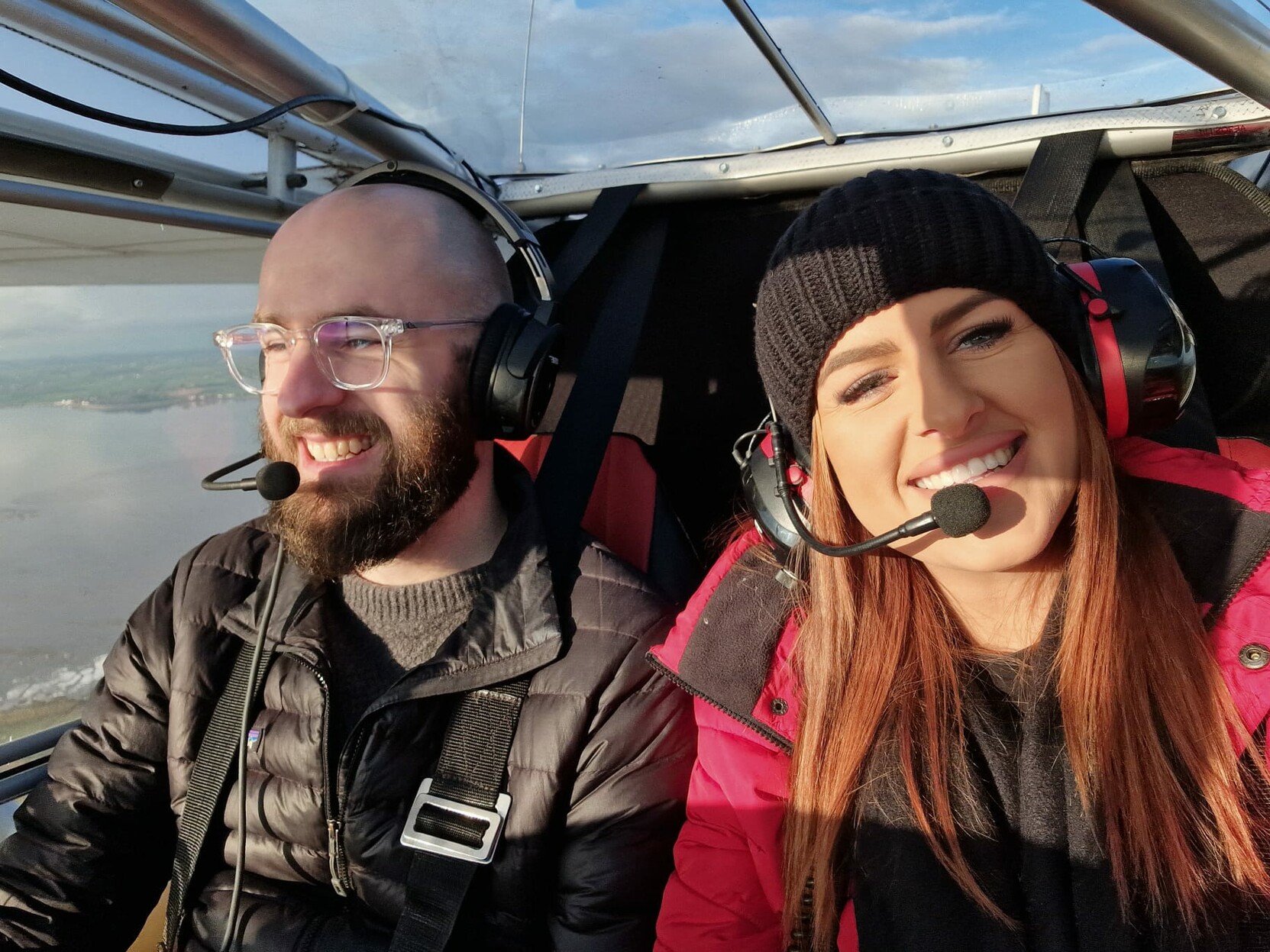 My sister and I smiling together while in the air