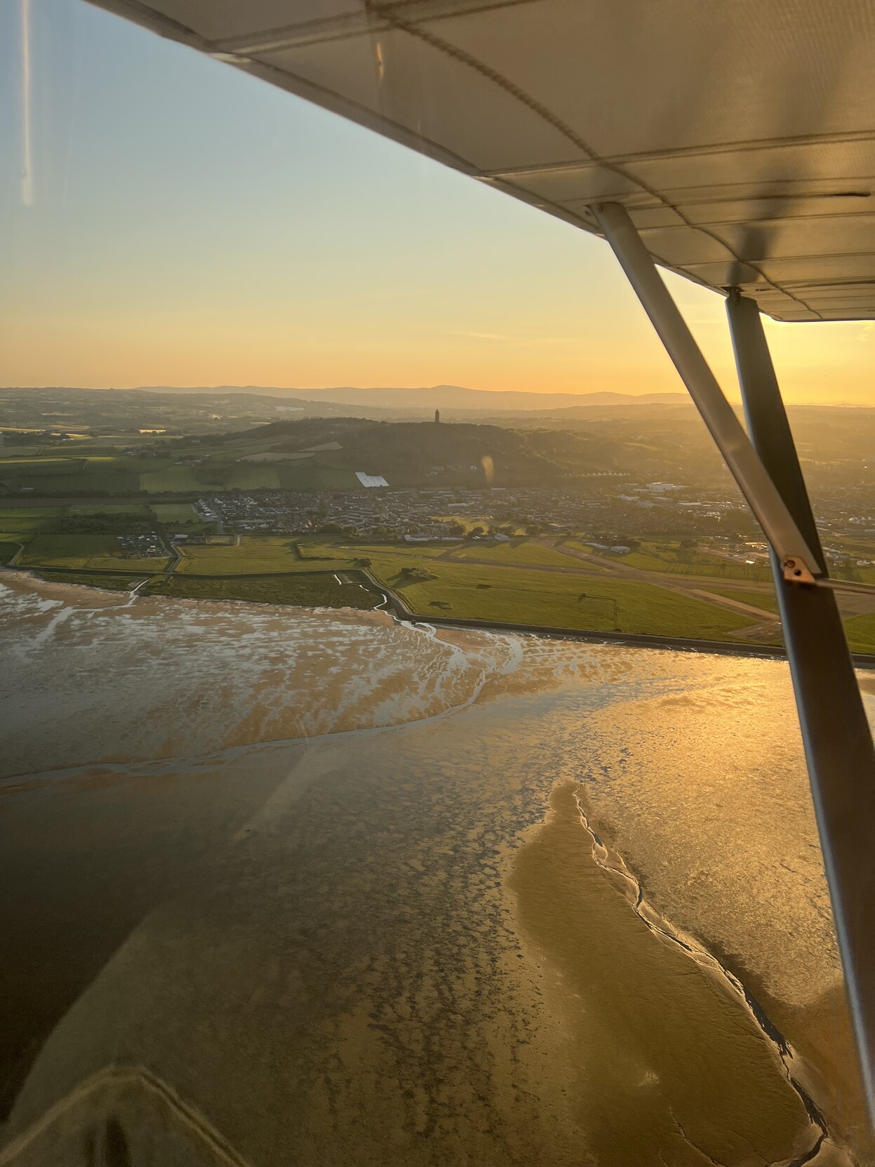 Scrabo Tower at sunset seen from a small airplane