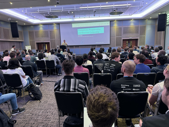 A room full of people waiting to listen to the PyMC tutorial at PyData London 2024