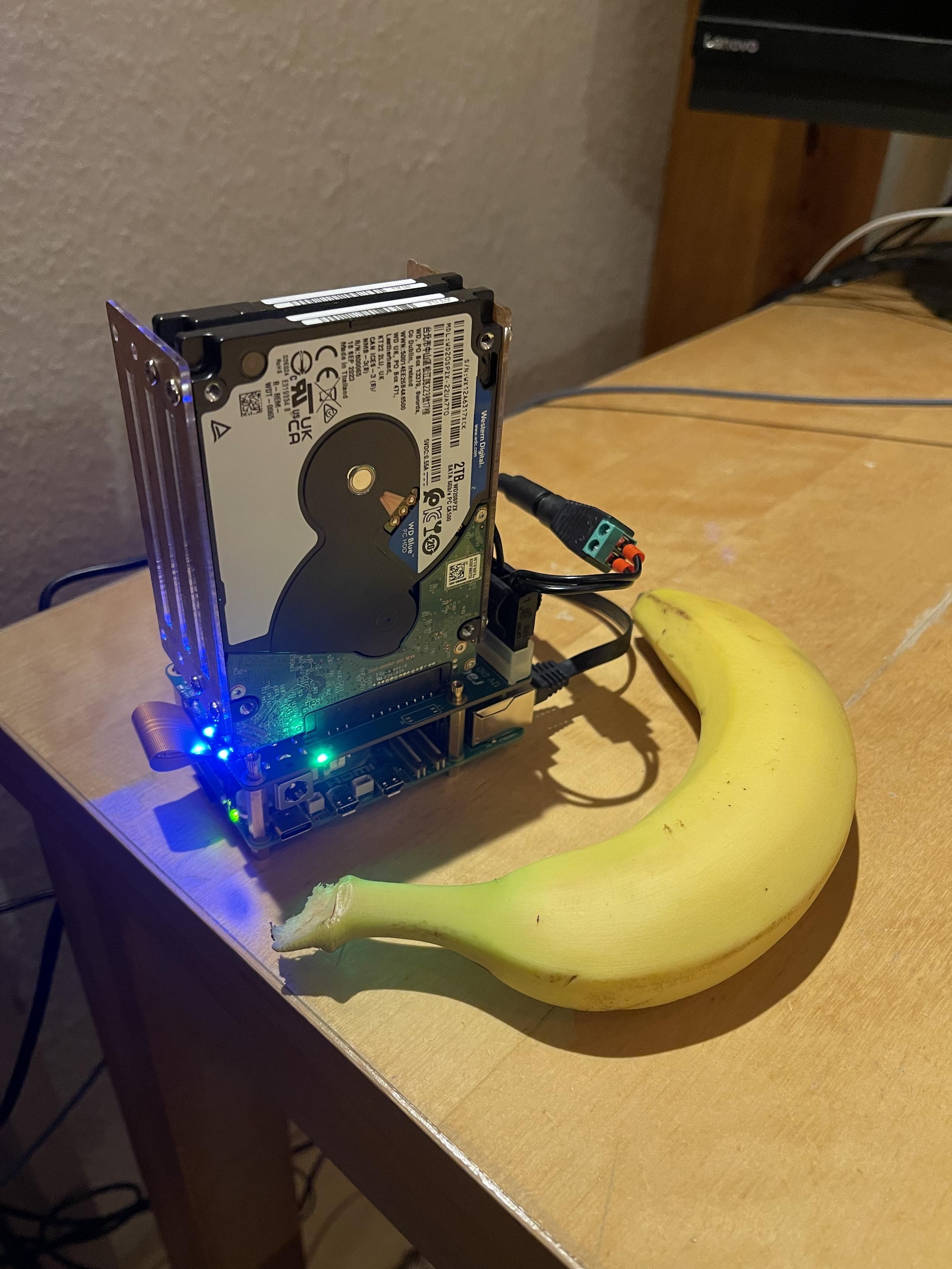 A 2.5 inch hard drive with a computer attached to it. Banana for scale. (The computer is smaller).