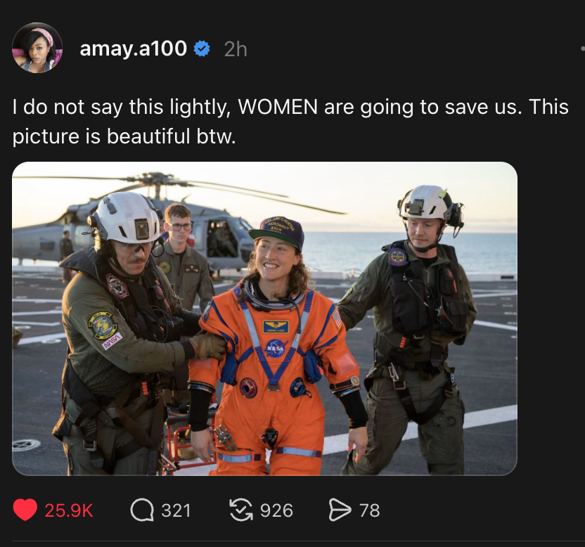 Photo of Artimas 2 recovery of the astronauts from the splashdown. Two helicopter pilots escort astronaut Christina Koch from the capsule to recovery on board local ship.