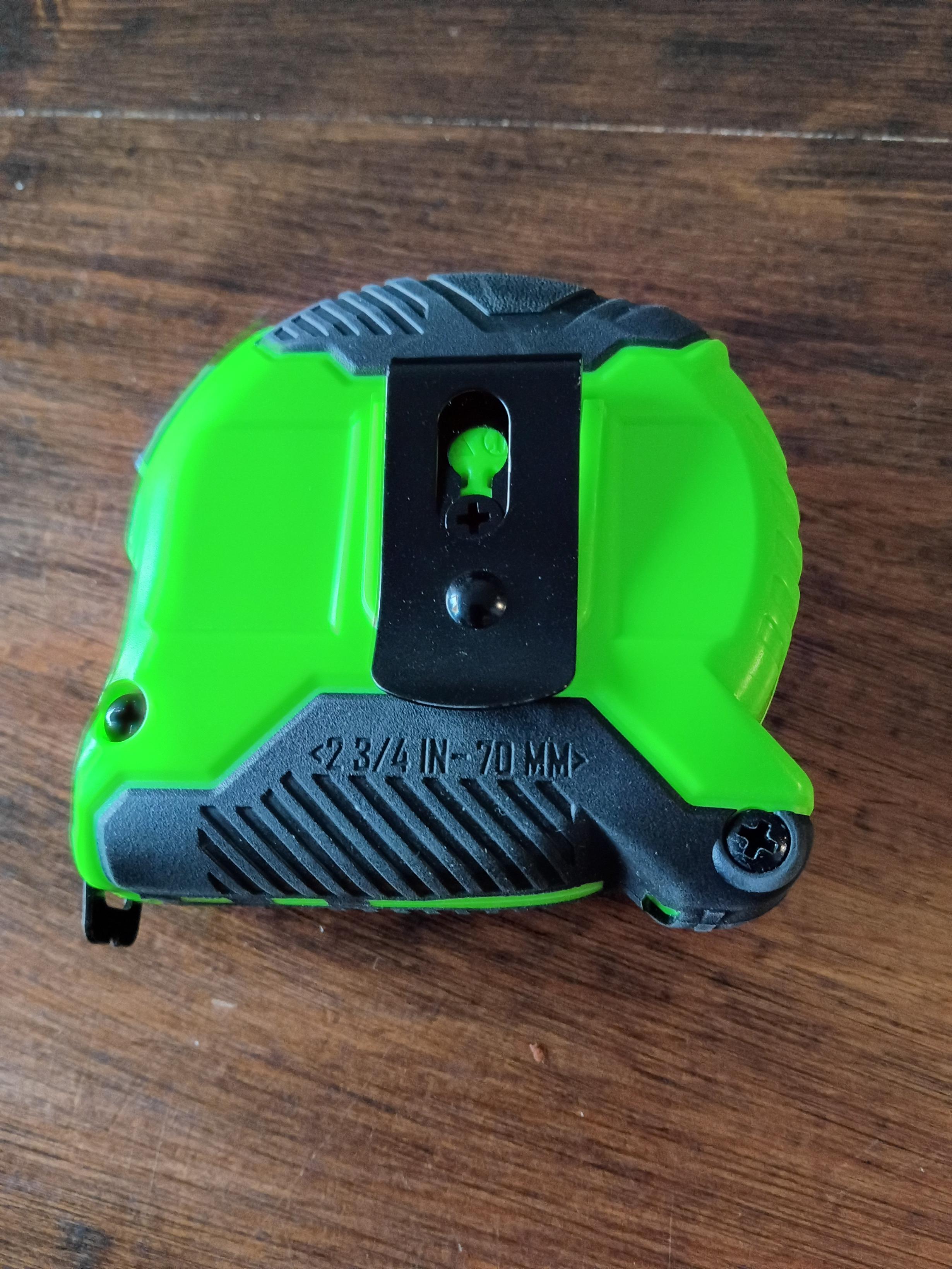 The back of a tape measure reading 2 3/4in / 70mm