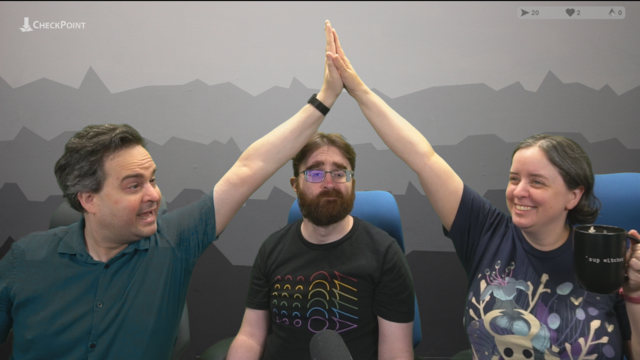Beej and Heather high five while Paul is stuck in the middle