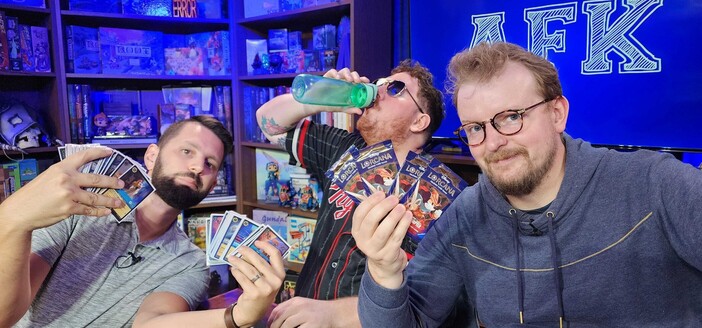 James Wheeler and Graham showing off some Lorcana cards