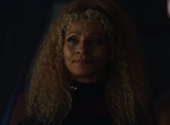 Raffaela Musiker as portrayed by Michelle Hurd.

She is a black human woman with long, very curly hair.