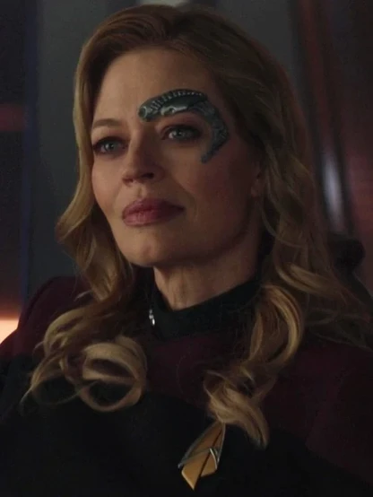 Seven of Nine as portrayed by Jeri Ryan.

She is a human female with long blonde hair in loose curls, and blue eyes. Around her left eye is a borg implant.