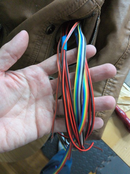 holding wires from LEDs, hanging out of the front jacket pocket