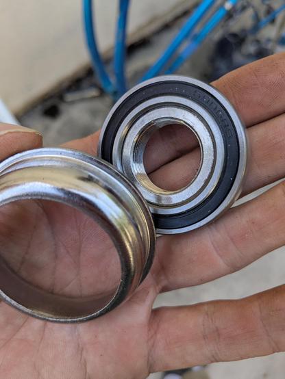 a new sealed ball bearing, seated in an aluminum machined outer race, below a steel inner race