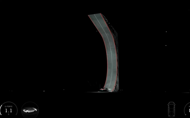 A car drives upside off a ramp and then engages rocket thrusters to spin around and land safely.