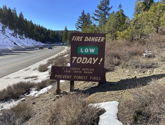 Current picture -- same sign (fire danger Low) but the bear has been sawn off and stolen