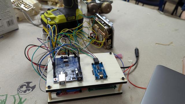 The supporting electronics are screwed to some things boards and arranged in a neater stack