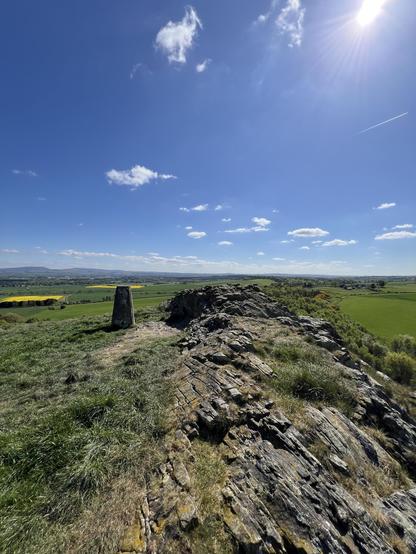 The top of the Craig with some rocks and a trig point.