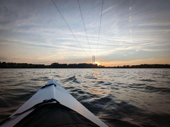 One of a series of photographs showing early autumn scenes of people kayaking on a lake.