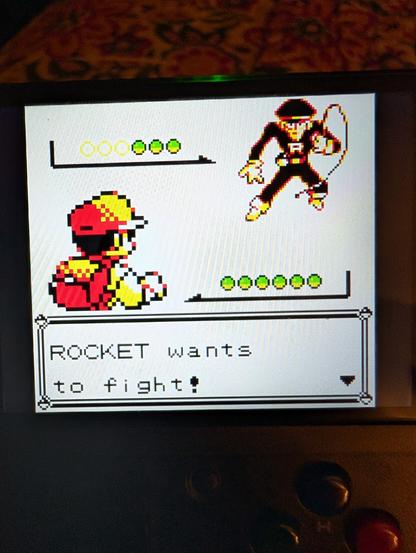 A shot of a lowrez Gameboy screen showing A Team Rocket grunt, ready to fight!