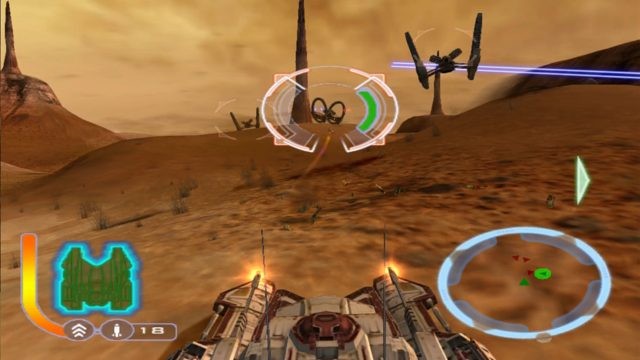 A screenshot from Star Wars The Clone Wars. It shows the player in a Republic Tank advancing up a hill, in the distance a ground of Hellfire Droids (giant pairs of wheels with rocket launchers attached to them) advancing towards the player.