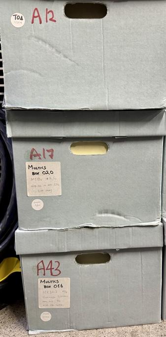a stack of bankers boxes containing the MIT Multics archive