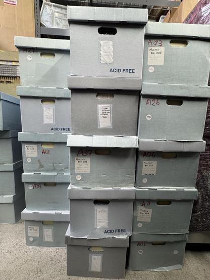 a stack of bankers boxes containing the MIT Multics archive