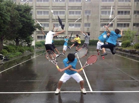 Photograph with one Japanese teen in the finishing pose of Roronoa Zoro's 3-sword style, holding tennis racquets, while his opponents are tossed aside wielding umbrellas.