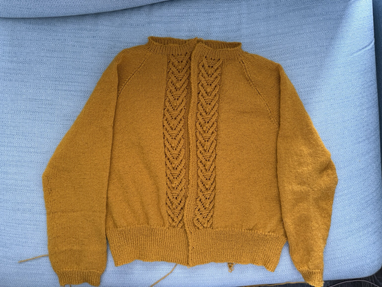 A yellow hand knit cardigan