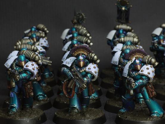 Ranks and ranks of old school space marines in a lovely turquoise with white pauldrons