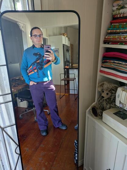 Mirror selfie of me in boy mode wearing the outfit in the flat lay