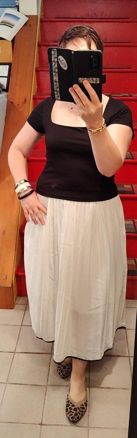 Billowy white skirt with black edging, black sweetheart neck T untucked. Bangle bracelets. Leopard print flats. Not this necklace but it might get layered with other necklaces in the final version.