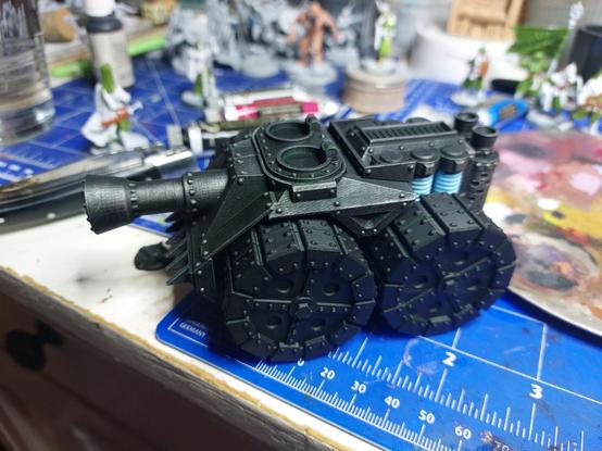 Tank with huge metal wheels and power spools