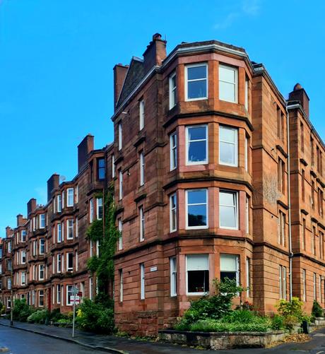 A block of red sandstone Glasgow tenements.