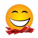 A yellow smiling face emoji that has black eyes and a wide white mouth bordered in black. There is a red ribbon on the bottom of the emoji.