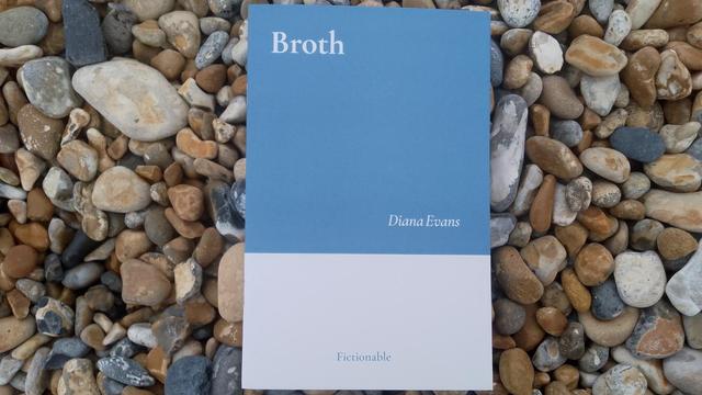 A copy of Broth by Diana Evans on a pebble beach