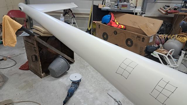 The initial experiment setup. Two small Sharpie grids on the belly of the fuselage.

Buff one of the grids with one of the polishing pads...but don't remove all the Sharpie on the first grid....