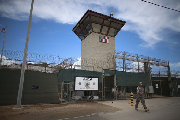 A military officer walks from the entrance to Camp VI at the U.S. military prison for "enemy combatants" on June 25, 2013, in Guantanamo Bay, Cuba: